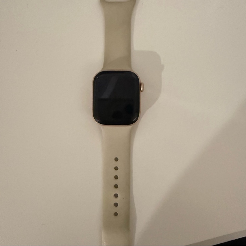 Apple Smartwatch with Cream Band and Black Display